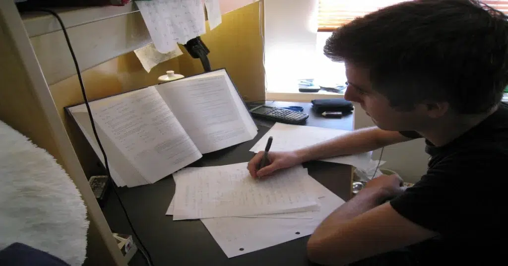 Studying with notes and textbooks.
